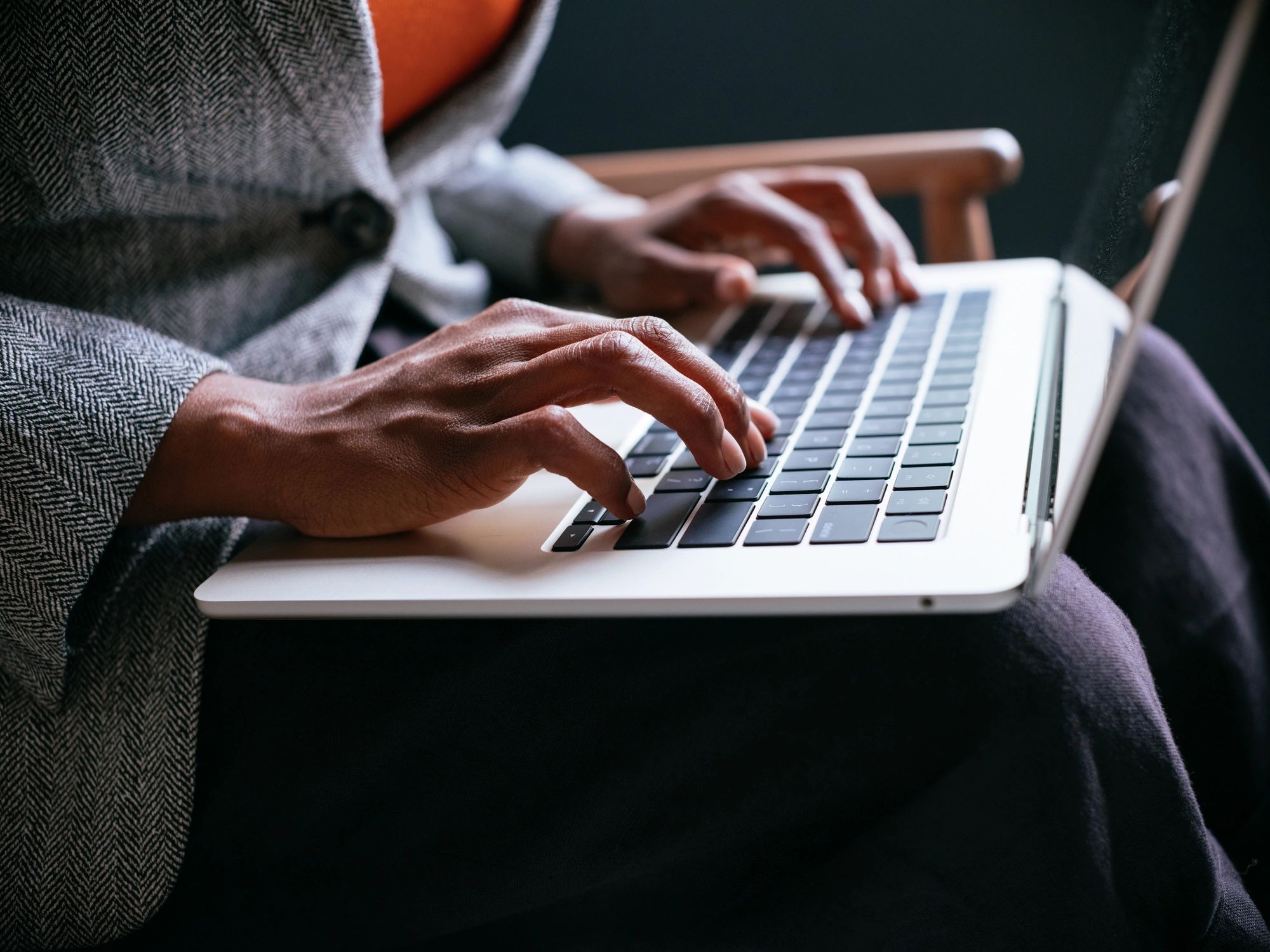 Typing reflective notes on a laptop keyboard