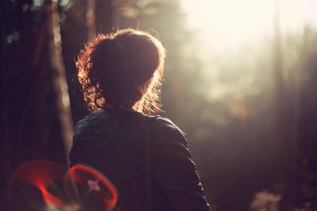 Woman using reflective writing to reframe her story